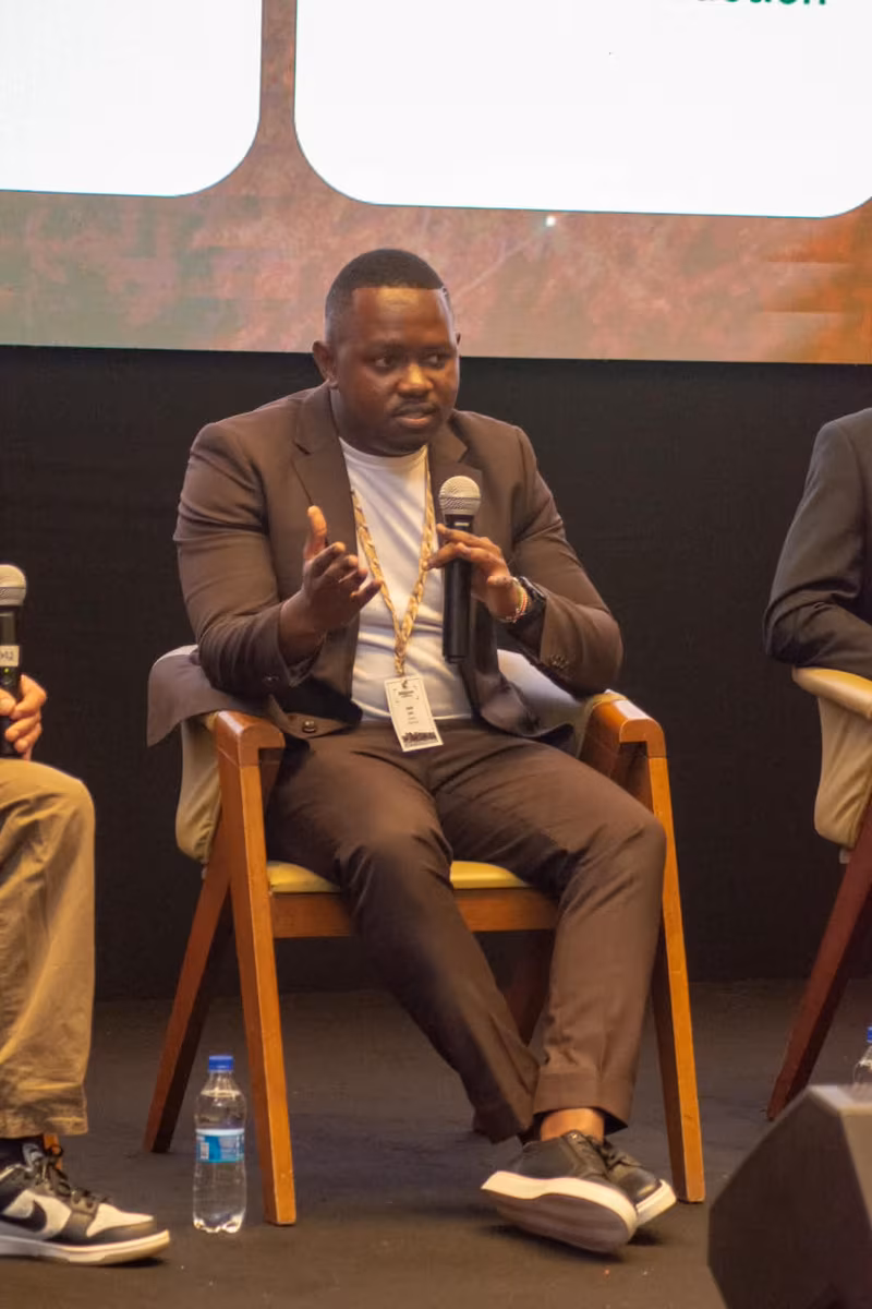 Edwin Rogoi speaking into a microphone during a Wildscreen Festival Kenya panel